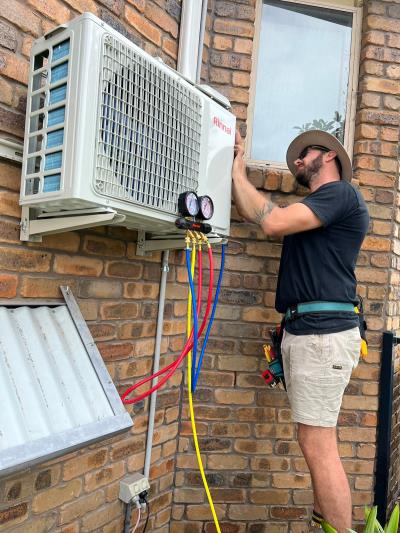 Man installing an air conditioning unit