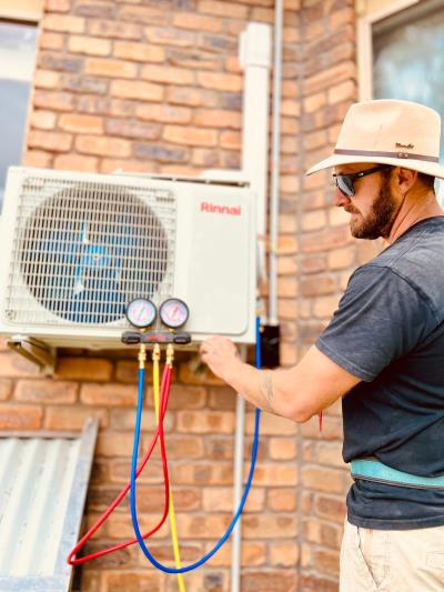 Man working on air conditioning unit